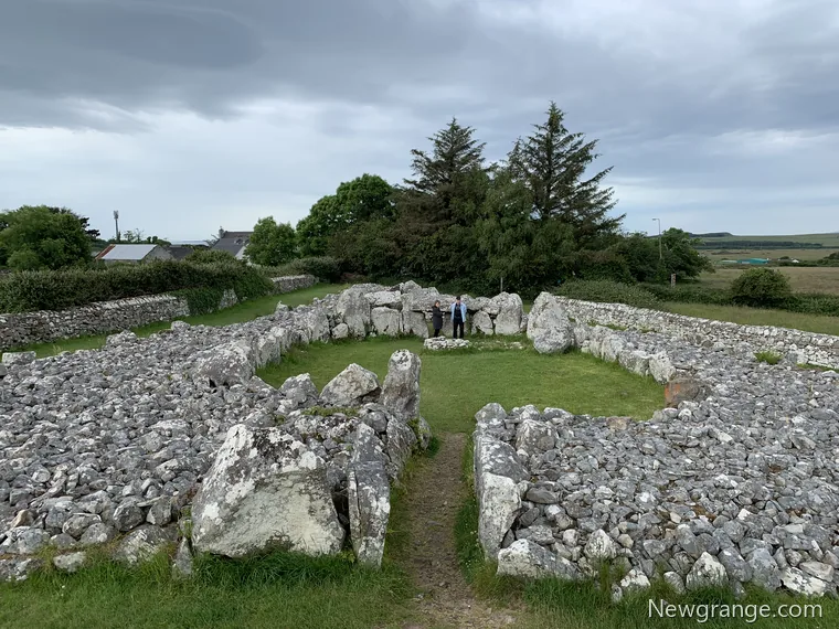 Elevated view of Creevykeel court tomb in County Sligo, showing the entrance passage, grassy oval court and chamber entrance within the stone cairn.